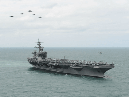 ATLANTIC OCEAN (March 22, 2015) Aircraft from Carrier Air Wing 1 fly in formation over the Nimitz-class aircraft carrier USS Theodore Roosevelt (CVN 71) during an airpower demonstration March 22, 2015. Theodore Roosevelt, homeported in Norfolk, is conducting naval operations in the U.S. 6th Fleet area of operations in support …