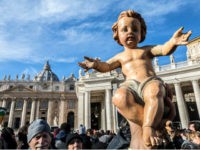 VATICAN CITY, VATICAN - DECEMBER 17: Children and faithfuls have figurines of baby Jesus blessed by Pope Francis during his Sunday Angelus prayer in St. Peter's Square on December 17, 2017 in Vatican City, Vatican. The tradition of representing the Nativity scene with figurines of the Holy Mother, Jesus and …