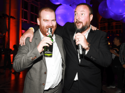 Andrew Creighton, left, president of Vice Media, with Mr. Smith at a company party in 2011