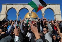 Palestinian Muslim worshippers shout slogans during Friday prayer at the Al-Aqsa mosque compound in Jerusalem's Old City on December 8, 2017 Palestinian Muslim worshippers shout slogans during Friday prayer at the Al-Aqsa mosque compound in Jerusalem's Old City on December 8, 2017
