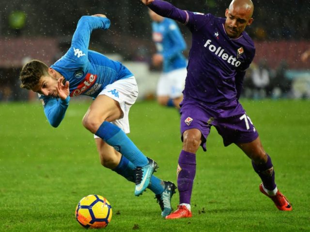 Napoli's Dries Mertens (left) avoids a challenge from Fiorentina's Bruno Gaspar during th