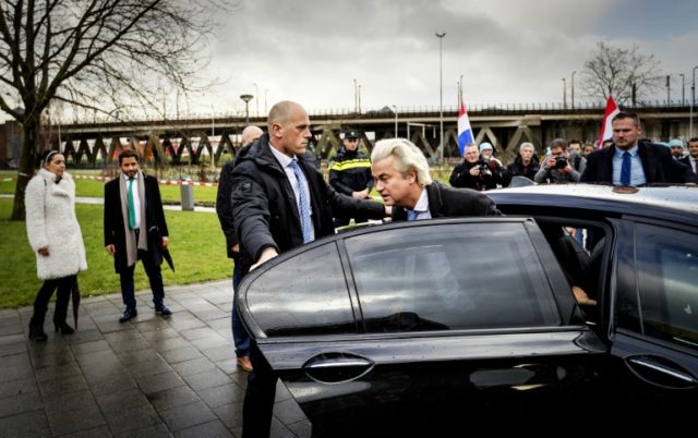 Leader of Dutch far-right Party for Freedom (PVV) Geert Wilders (C) arrives for a statemen