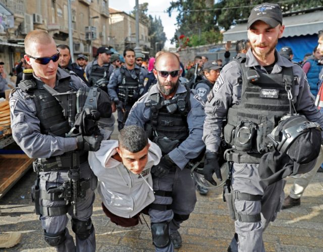Israeli security forces detain a Palestinian youth in Jerusalem's Old City