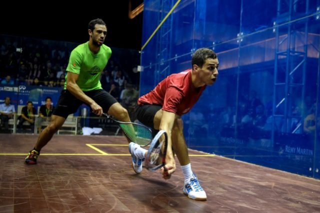 Ali Farag (R) of Egypt plays against Ramy Ashour (L) of Egypt during the men's finals of J