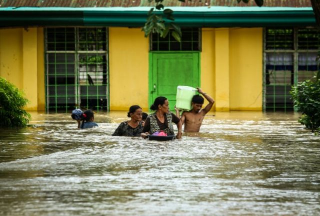 Residents evacuate after Tropical Storm Tembin struck in Kabacan, the southern island of M