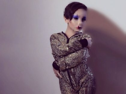 9 year old boy dressed as a drag queen for erotic clothing company