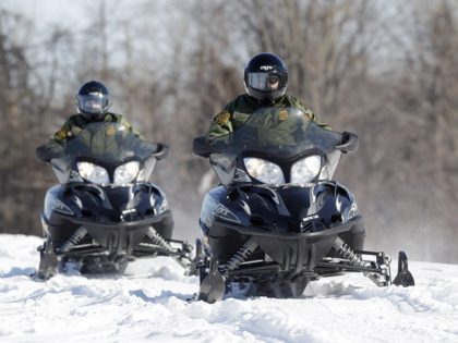 In this Feb. 10, 2011 photo, U.S. Border Patrol agents Janice Jones, left, and Glenn Pickering ride snowmobiles along the St. Lawrence River in Massena, N.Y. Depictions of the northern border as out of control may not be quite accurate because assessment tools used are outdated, the head of the …