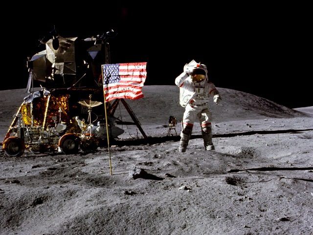 John Young salutes the U.S. flag at the Descartes landing site on the moon during the first Apollo 16 extravehicular activity. NASA says the astronaut, who walked on the moon and later commanded the first space shuttle flight, died on Friday, Jan. 5, 2018.