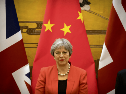 British Prime Minister Theresa May attends a signing ceremony at the Great Hall of the Peo