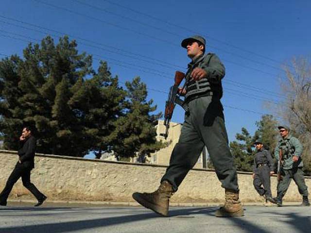 Afghan security forces are pictured near the main gate of the National Directorate of Secu