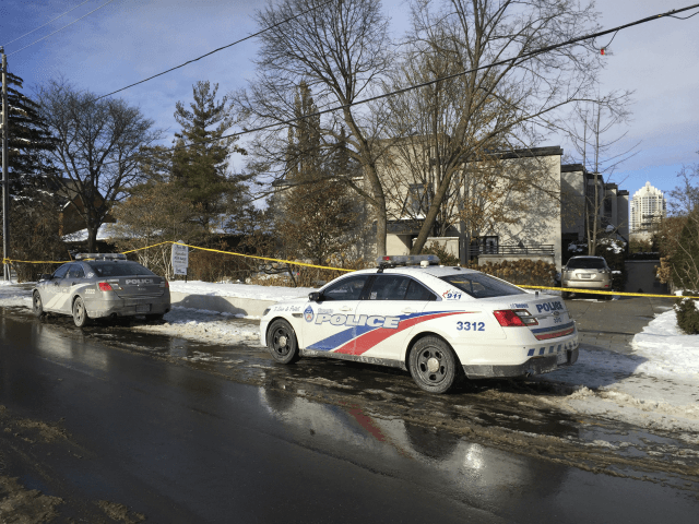Police cars are parked outside the home of billionaire Barry Sherman on Saturday, Dec. 17, 2017 in Toronto. Sherman and his wife were found dead in the north Toronto mansion on Friday, Dec. 16. Police said they were investigating the deaths as suspicious. (AP Photo/Robert Gillies)
