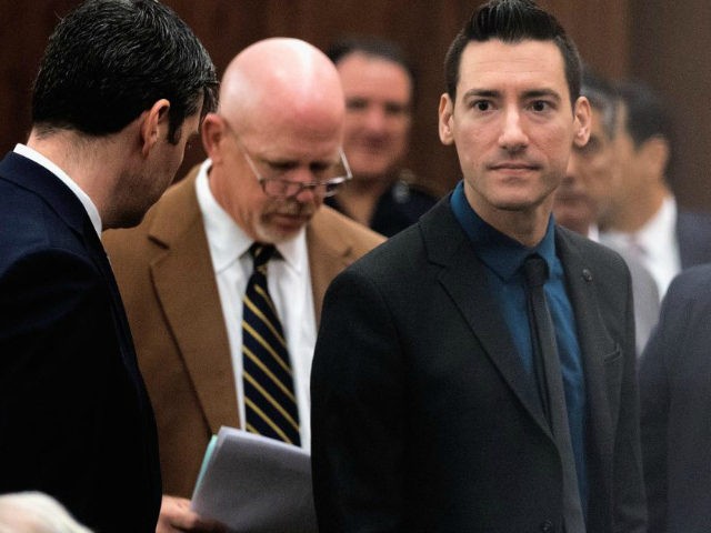 David Daleiden, right, one of the two anti-abortion activists indicted last week, leaves the courtroom with attorney's Peter Breen, left, and Terry Yates, center, after turning himself in to authorities Thursday, Feb. 4, 2016, in Houston. Daleiden and Sandra Merritt are charged with tampering with a governmental record, a felony …