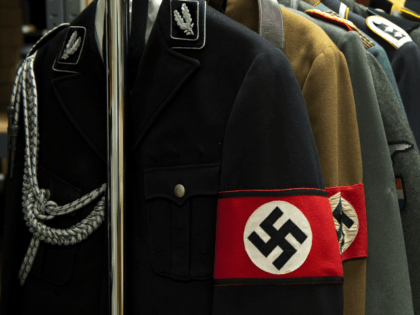 Nazi uniforms on display at Connecticut-based Alexander Autographs on July 19, 2011 in Stamford, Connecticut. The uniforms will be sold separately from some of the diaries of feared Nazi war criminal Josef Mengele, the so-called 'Angel of Death' who carried out gruesome medical experiments on prisoners at Auschwitz, The diaries, …
