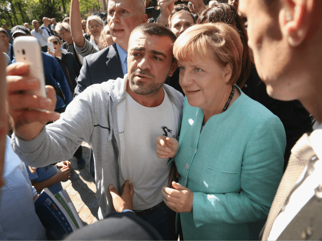 BERLIN, GERMANY - SEPTEMBER 10: German Chancellor Angela Merkel pauses for a selfie with a
