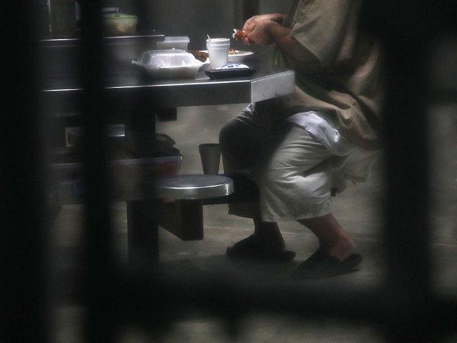 A prisoner prepares to eat lunch at the 'Gitmo' maximum security detention center on Octob