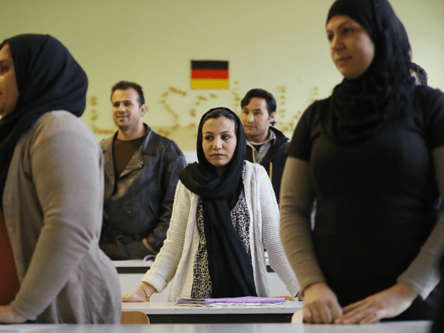BERLIN, GERMANY - NOVEMBER 11: Recently-arrived immigrants, including from countries such as Iraq, Afghanistan and Iran, attend a first orientation class for asylum applicants whose chances of receiving longer-term asylum are slim at a classroom of the Johanniter charity on November 11, 2016 in Berlin, Germany. Germany has taken in …