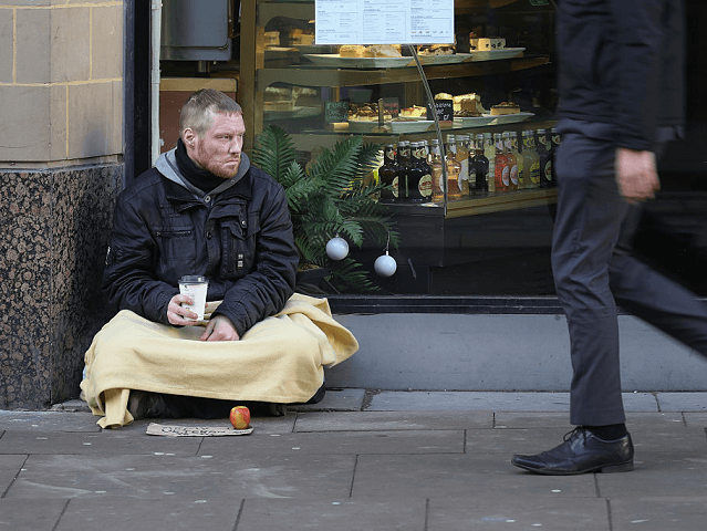 MANCHESTER, ENGLAND - JANUARY 13: Homeless army veteran Phil (no surname given) begs for small change on the streets of Manchester on January 13, 2017 in Manchester, United Kingdom. Many homeless people are spending the night on the streets in freezing temperatures as the Met Office continues to issue weather …