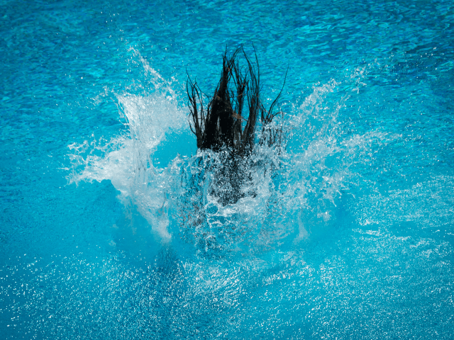 TOPSHOT - A participant of the Splashdiving World Championships jumps into the water of a pool in Sindelfingen, southern Germany, on July 30, 2017. The competition commonly known as 'Arschbomben-WM' (litterally: ass-bomb world championships) requires from participants to jump from a five or ten meters high platform in order to …
