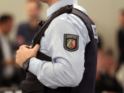 A judicial officer stands in the courtroom on the fairground in Duesseldorf, western Germa