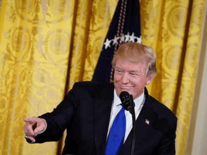 US President Donald Trump speaks during a working session with mayors in the East Room of