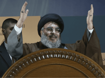 In this Aug. 2, 2013, file photo, Hezbollah leader Sheikh Hassan Nasrallah gestures during a rally to mark Jerusalem day or Al-Quds day, in a southern suburb of Beirut, Lebanon. The leader of Lebanon's Hezbollah on Monday, Nov. 20, 2017, categorically denied accusations that his group is sending weapons to …