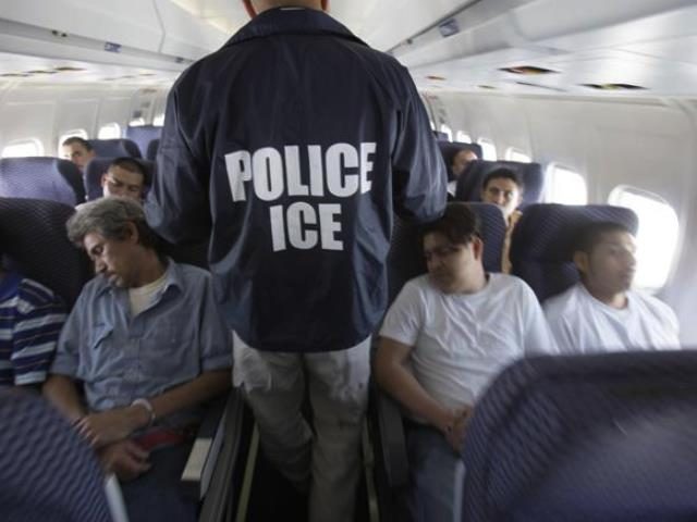 ICE officer with illegal immigrants on airplane.