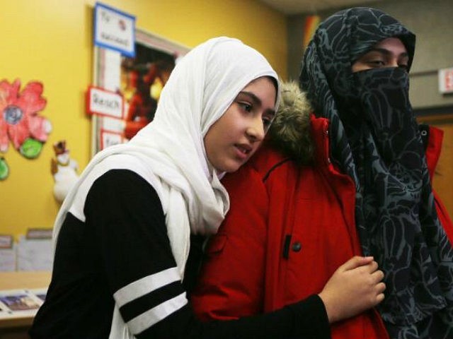 TORONTO, ON- JANUARY 12 - Khawlah Noman's hugs her mother, Saina Samad, after talking to m