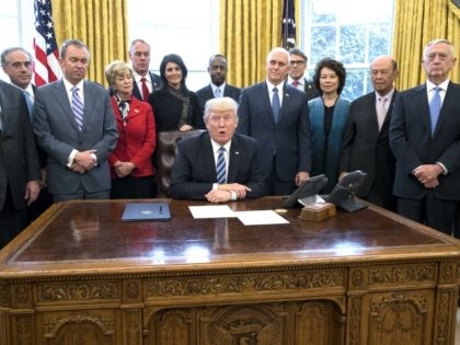 President Donald Trump delivers brief remarks before signing an executive order entitled, 'Comprehensive Plan for Reorganizing the Executive Branch', beside members of his Cabinet in the Oval Office of the White House March 13, 2017 in Washington, DC. Also pictured (L to R); Secretary of State Rex Tillerson, Secretary of …