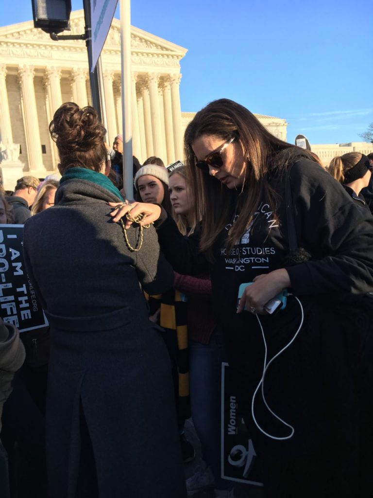At the March for Life on January 19, 2018, a woman prays for someone.