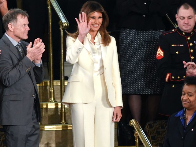 US First Lady Melania Trump waves as she arrives for the State of the Union address at the
