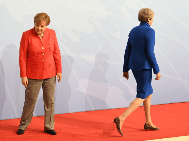 HAMBURG, GERMANY - JULY 07: Prime Minister Theresa May and German Chancellor Angela Merkel