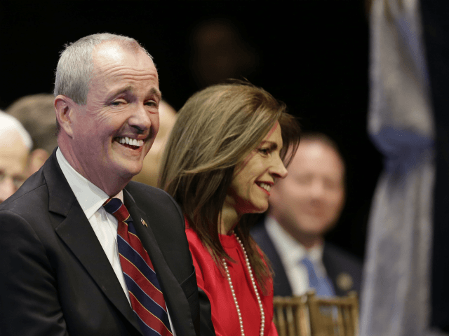 New Jersey Gov.-Elect Phil Murphy laughs during an inauguration ceremony in Trenton, N.J.,