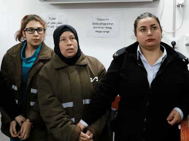 Nour Tamimi and her auntie Nariman Tamimi (2R), who are being detained after a viral video