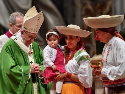 Pope Francis (L) leads a mass marking the World day of Migrants and Refugees on January 14, 2018 at St Peter's basilica in the Vatican. / AFP PHOTO / VINCENZO PINTO (Photo credit should read VINCENZO PINTO/AFP/Getty Images)