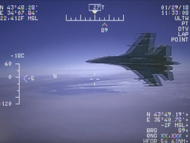 Video: russian jet buzzes u. S. Military plane in international airspace