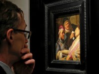 The-Unconscious-Patient-an-Allegory-of-the-Sense-of-Smell-Rembrandt-ap A visitor to the booth of Galerie Talabardon & Gautier at the TEFAF fine art fair looks at a newly discovered painting by Dutch master Rembrandt titled The Unconscious Patient (Sense of Smell) dated at around 1624-25, oil on panel 21.6x17.8 cm, in Maastricht, southern Netherlands, Thursday, March 10, 2016. …