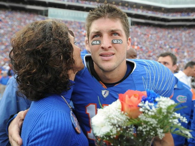 Florida quarterback Tim Tebow embraces his mother, Pam, during a pre-game ceremony for gra