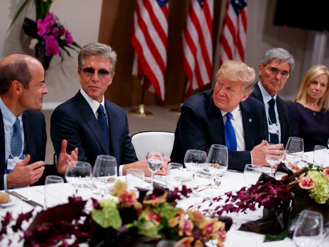 President Donald Trump listens during a dinner with European business leaders at the World
