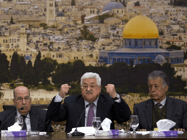 Palestinian President Mahmoud Abbas, center, speaks during a meeting with the Palestinian Central Council, a top decision-making body, at his headquarters in the West Bank city of Ramallah, Sunday, Jan. 14, 2018. (AP Photo/Majdi Mohammed,l)