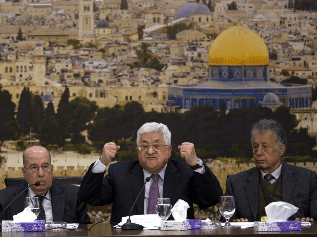 Palestinian President Mahmoud Abbas, center, speaks during a meeting with the Palestinian