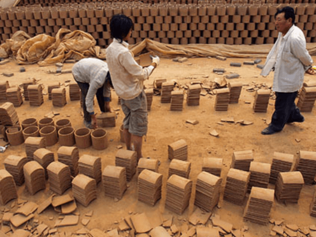 A man searched for his child, one of hundreds who have been kidnapped, at this brick kiln