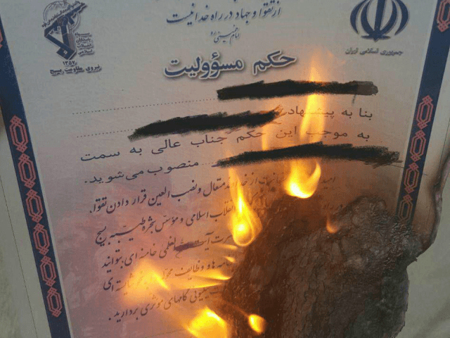More images emerging of #Iran-ians burning their #Basij membership cards in show of suppor