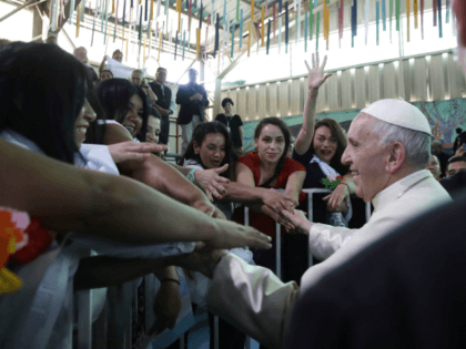 Pope Francis greets inmates at the San Joaquin women's prison in Santiago, Chile, Tuesday,
