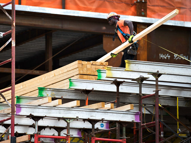 NEW YORK, NY - AUGUST 16: A construction laborer works on the site of a new residential bu