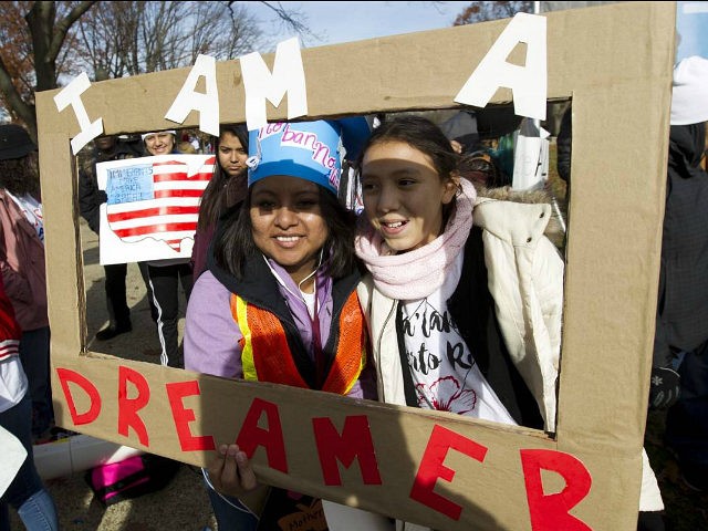 DemonstratorsKarina Velasco, left, and Gabi Sanchez hold a sign during an immigration rally in support of the Deferred Action for Childhood Arrivals (DACA), and Temporary Protected Status (TPS), programs, on Capitol Hill in Washington, Wednesday, Dec. 6, 2017. ( AP Photo/Jose Luis Magana)