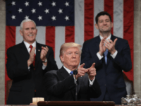 US President Donald Trump delivers the State of the Union address as US Vice President Mike Pence (L) and Speaker of the House US Rep. Paul Ryan (R-WI) (R) clap in the chamber of the US House of Representatives in Washington, DC, on January 30, 2018. / AFP PHOTO / …