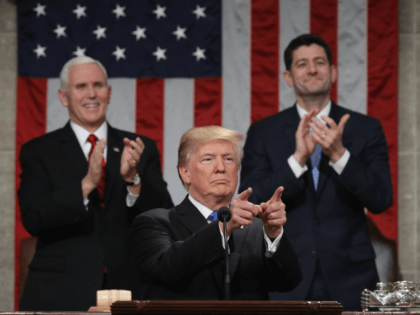 US President Donald Trump delivers the State of the Union address as US Vice President Mike Pence (L) and Speaker of the House US Rep. Paul Ryan (R-WI) (R) clap in the chamber of the US House of Representatives in Washington, DC, on January 30, 2018. / AFP PHOTO / …