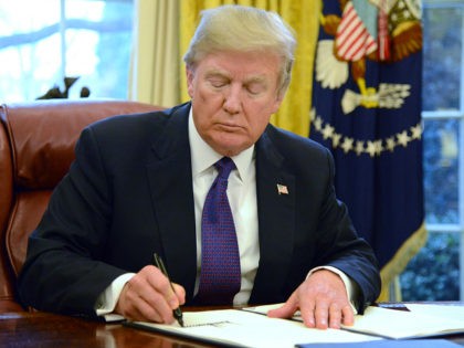 U.S. President Donald Trump signs Section 201 actions in the Oval Office of the White Hous