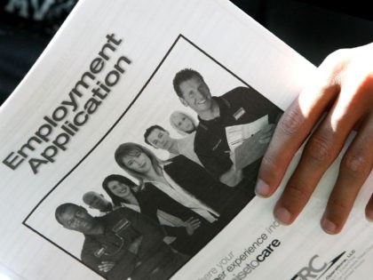 SAN BRUNO, CA - NOVEMBER 04: A student at Skyline College holds a employment application d