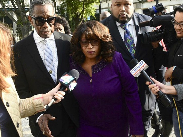 Former congresswoman Corrine Brown walks into Federal Court accompanied by pastor Rudolph McKissick, Sr. Brown appeared in Federal Court to be sentenced on fraud charges. Her former chief of staff, Ronnie Simmons and One Door for Education President Carla Wiley will also be sentenced. (Bob Mack/The Florida Times-Union via AP)